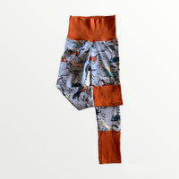 Wild Horses print with burnt orange cuffs & waistband.